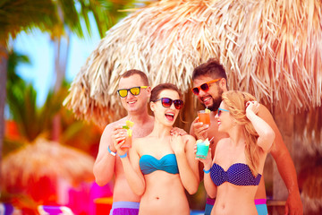 group of happy friends having fun on tropical beach, summer holiday party