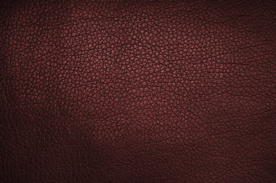 Red leather texture closeup, useful as background