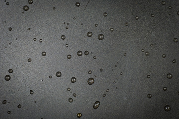 Metal background with water drops