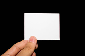 Hand holding white blank paper