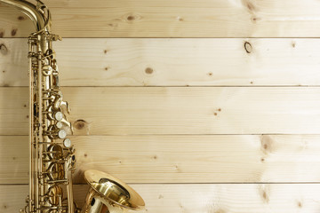 Saxophone on the Wood Background