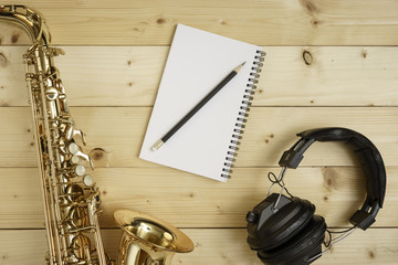 Saxophone on the Wood Background