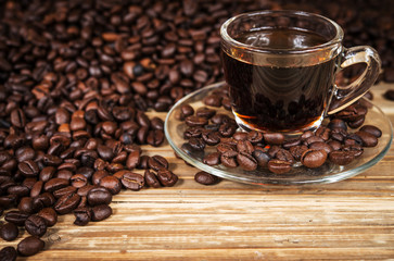 Cup of coffee. View from above on a wooden surface.