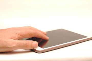 hand on tablet