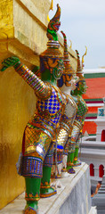 Demon supporting golden chedis, wat phra kaew, bangkok, thailand