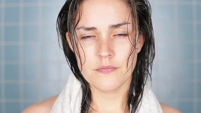 healthy young woman in bathroom waking up portrait