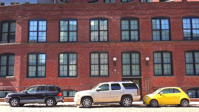 Establishing shot of a brownstone brick office building in Brooklyn's dumbo neighborhood.