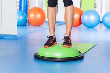 fitness, sport, training and lifestyle concept - woman stretching ina  gym.