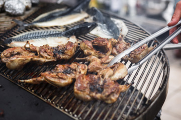 Fresh barbecue chicken on open grill
