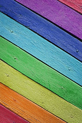 Wooden boards painted in the colors of the rainbow