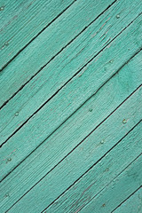 Wooden slats painted turquoise paint