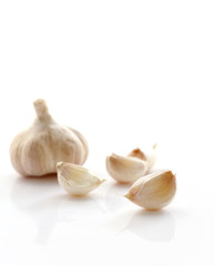 Fresh organic garlic isolated on white selective focus.