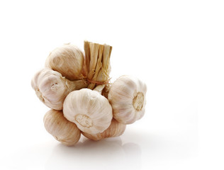 Group of fresh organic garlic isolated on white.