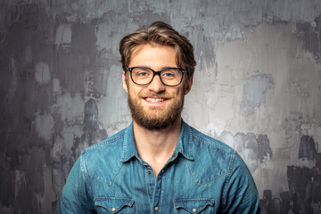 Young handsome man in glasses smiling