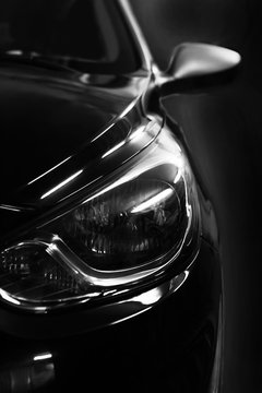 Fototapeta black car in patches of light
