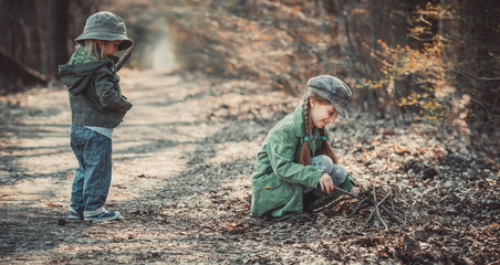 children play in the woods