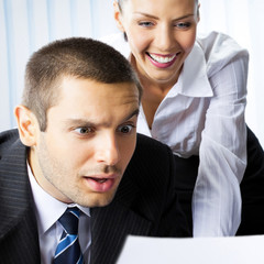 happy businesspeople working at office