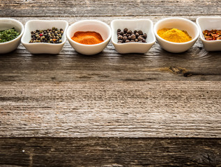 spices in bowls in horizontal row