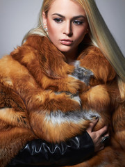 Winter beautiful Woman in Fur Coat.Beauty Fashion Model Girl.luxury