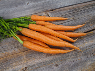 Carrots on an old kitchen table 