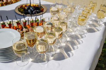 Close up photo with glasses of champagne on festive table