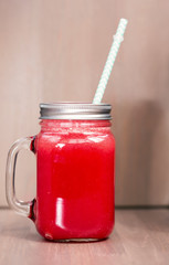 Watermelon smoothie in a mason jar
