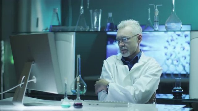 Exhausted Scientist is Thinking in Laboratory.

Shot on RED Cinema Camera in 4K (UHD).