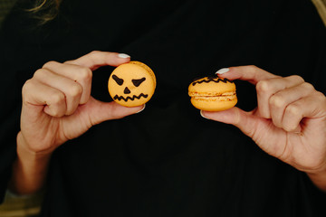 woman holding a biscuit for Halloween