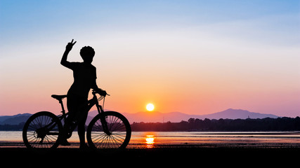 Fototapeta na wymiar Women bike at clean beach