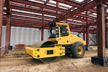 Large road roller being used to construct