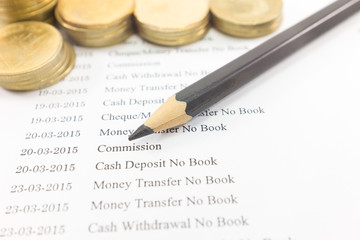Bank statement paper with coin and pencil : Commission focus. Ca