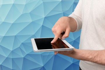 hands holding a tablet
