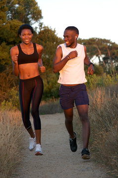 Young African American Couple Running Outside