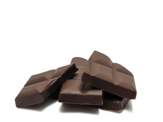 Slices of chocolate bar isolated on white background.