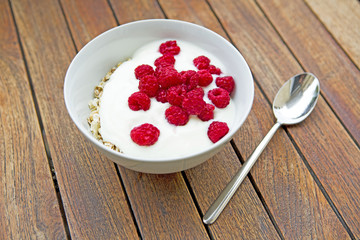 bowl of raspberries with yogurt
