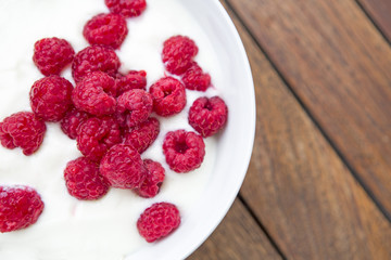 bowl of raspberries with yogurt