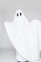 child dressed as a ghost for halloween