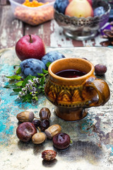 Fototapeta na wymiar Cup of tea in the autumn style