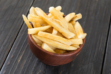 french fries on wood background