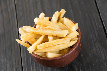 french fries on wood background