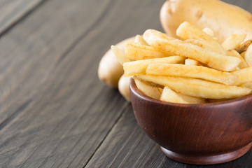 french fries on wood background