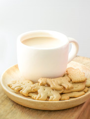 Coffee and bread on wooden dish