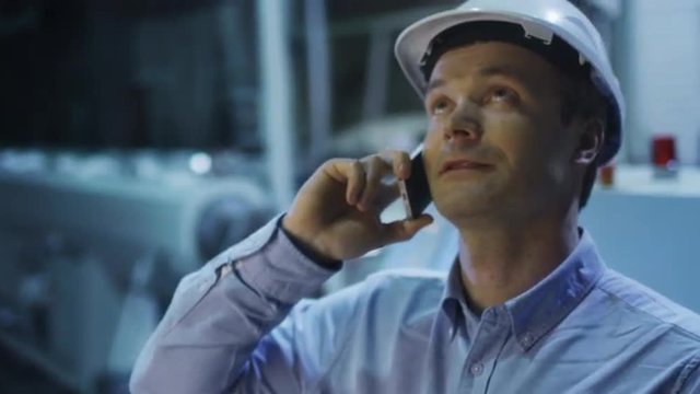 Engineer on the Phone in Factory