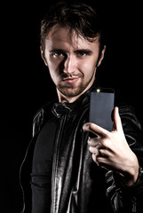 Stylish young man taking a selfie