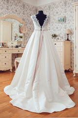 Fototapeta premium The Wedding Dress is Waiting for the Bride in the bBedroom.