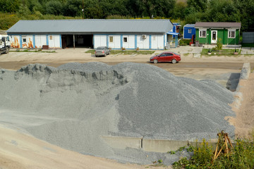 Crushed stone in the territory of production of concrete. Kaliningrad
