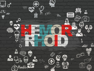 Health concept: Hemorrhoid on wall background