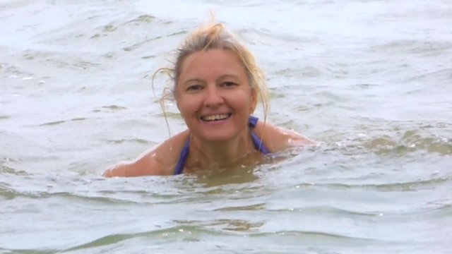 Woman basking in the warm sea