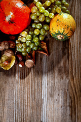 Autumn harvested fruit and vegetable on wooden table 