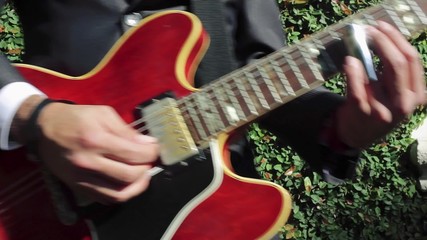 Cool shot of guitarist playing a classic electric guitar.  